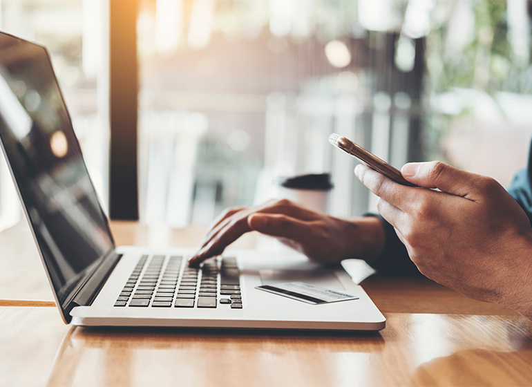 Online banking businessman using Laptop with credit card