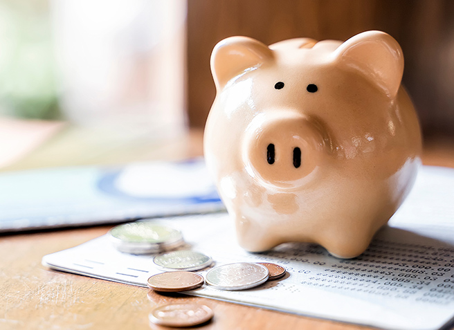 Piggy bank with coins and saving book